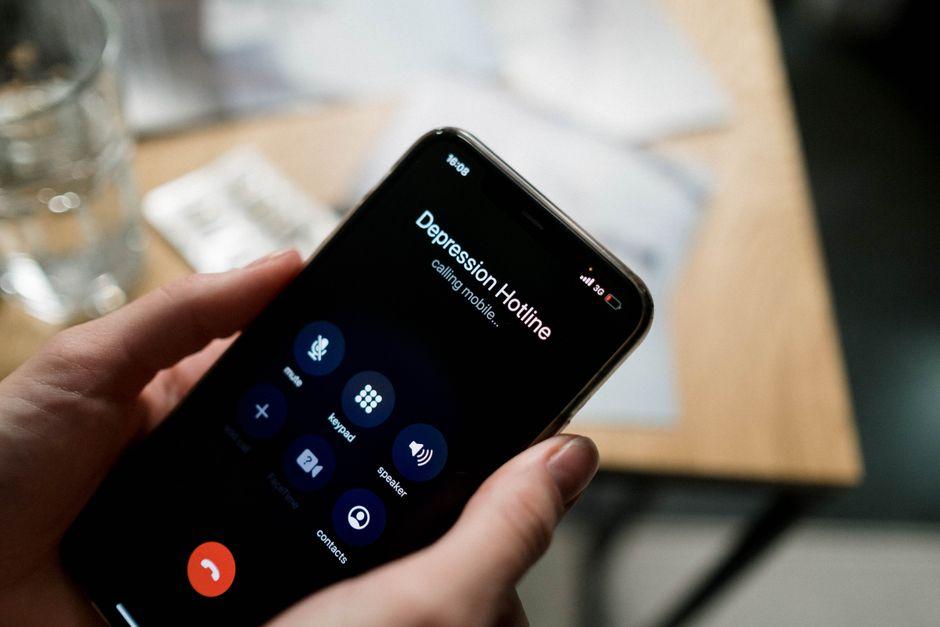 Close Up Shot of a Person Holding a Mobile Phone